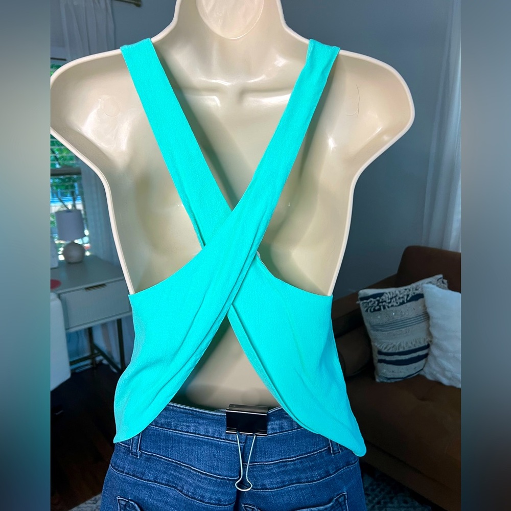 Size small turquoise open back criss-cross light material tank top